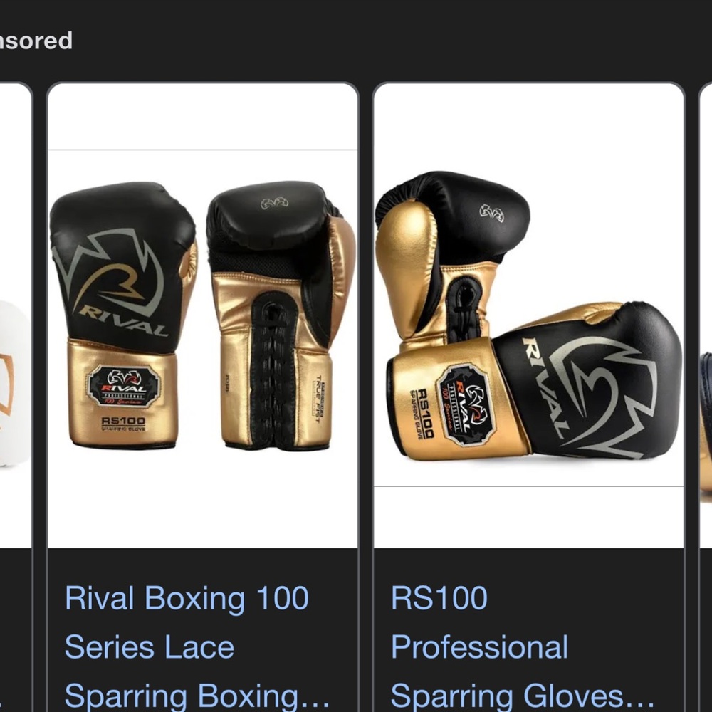 Rival RS100 Black and Gold Boxing Gloves
